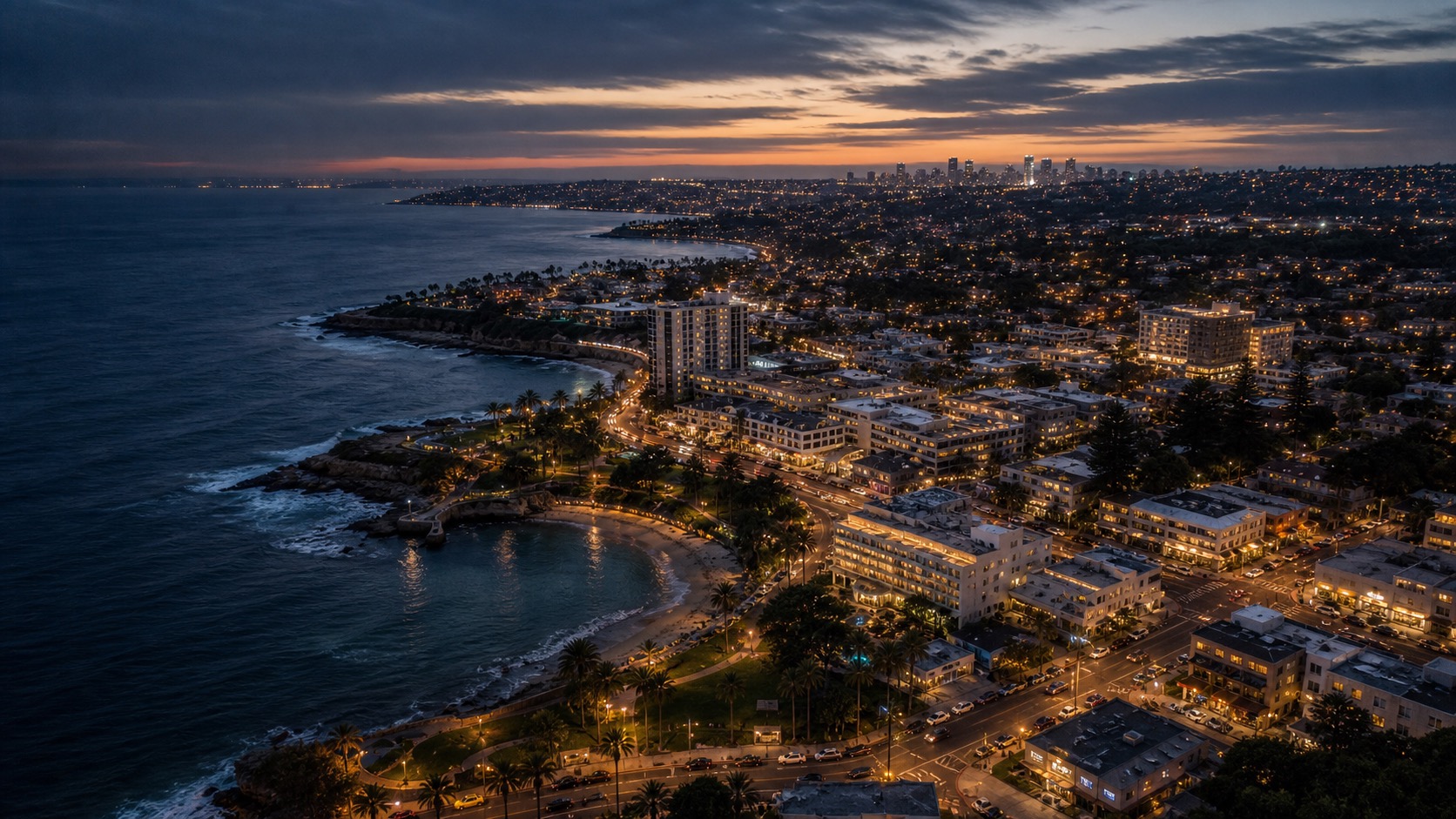 Aerial view of La Jolla coastline and greater San Diego at dusk